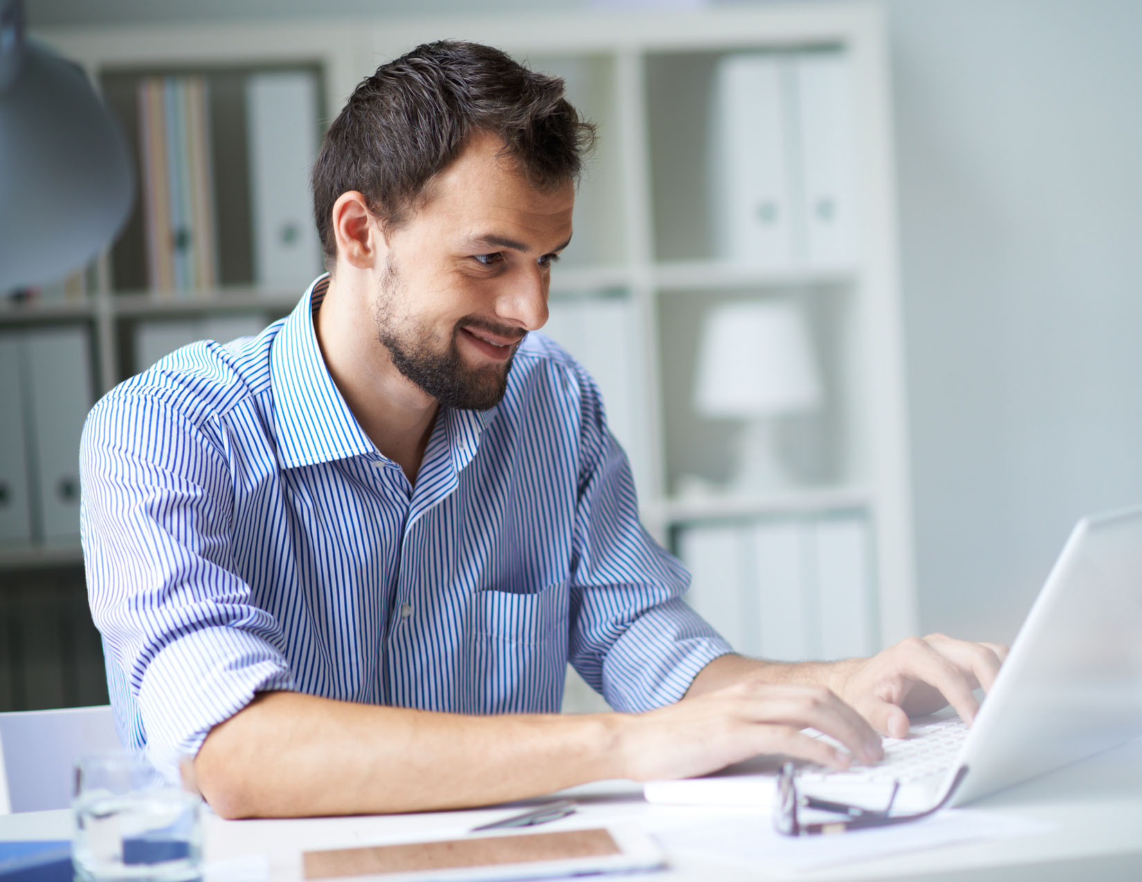 Businessman working with laptop in office